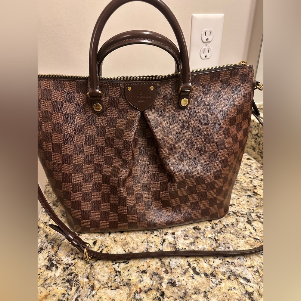 Louis Vuitton GM Sienna 
Brown Monogram with Gold Accents, excellent condition